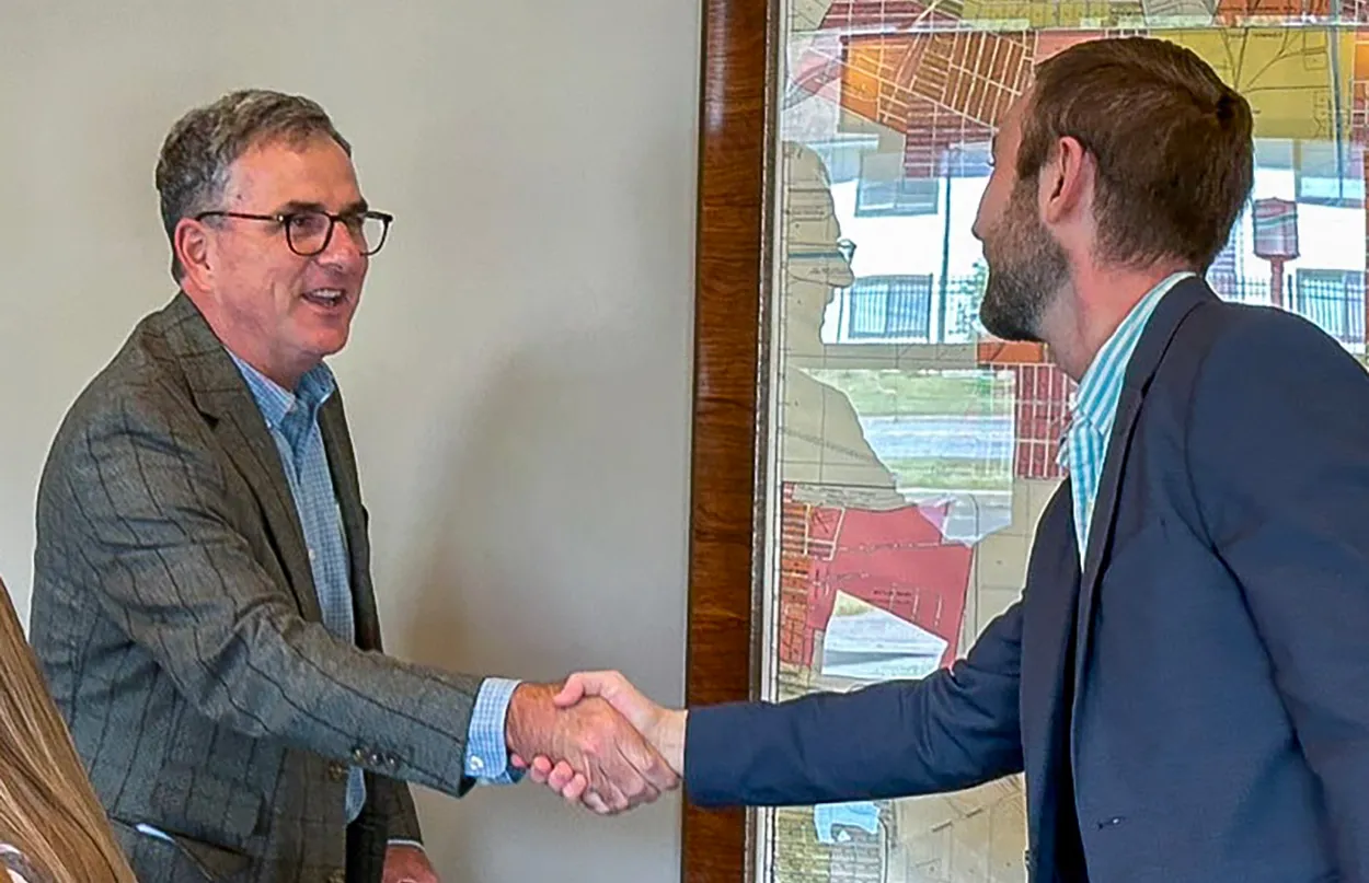 Attorney and client shaking hands